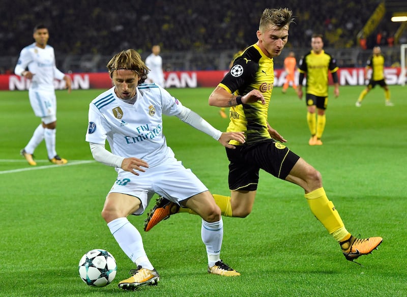>Real Madrid's Luka Modric, left, and Dortmund's Maximilian Philipp, right, challenge for the ball. Martin Meissner / AP Photo