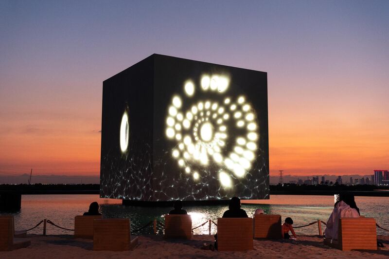 The glowing cube was centre-stage during the event, accompanied with fireworks and performances on its surrounding platform.