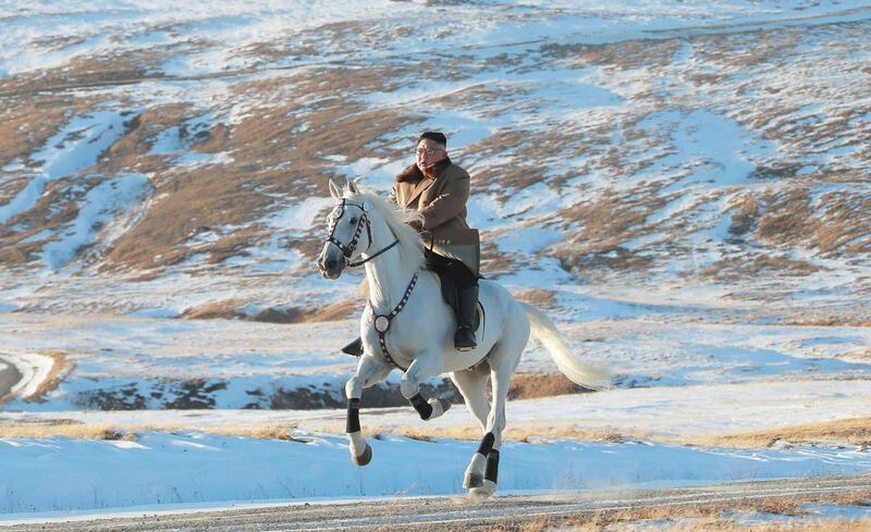 North Korean leader Kim Jong Un riding a white horse among the first snow at Mouth Paektu.  AFP