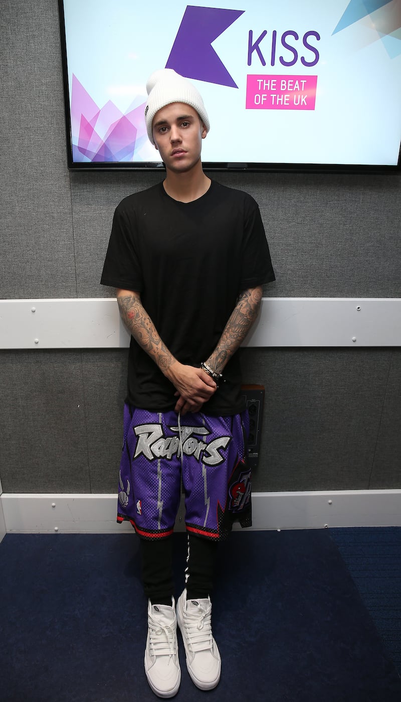 In a knitted beanie and basketball shorts to visit Kiss FM Studios on October 23, 2015, in London. Getty Images