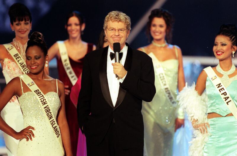 Springer with some of the Miss World contestants at the Millennium Dome in Greenwich, November 2000. PA