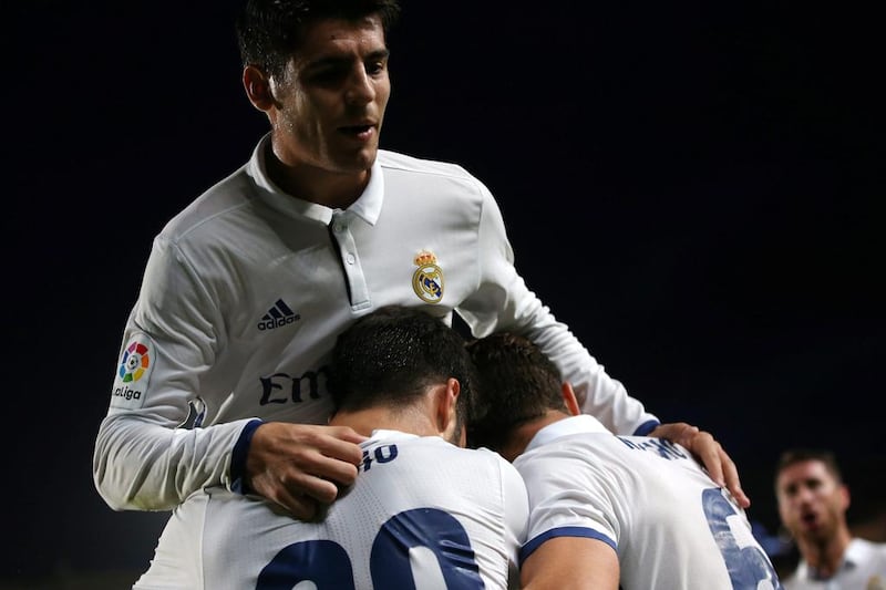 Real Madrid’s Marco Asensio celebrates a goal with his teammate Alvaro Morata. Juan Medina / Reuters