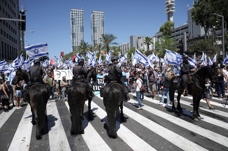 Mounted police in Tel Aviv, Israel, control protesters demonstrating against plans to overhaul the judicial system. AP
