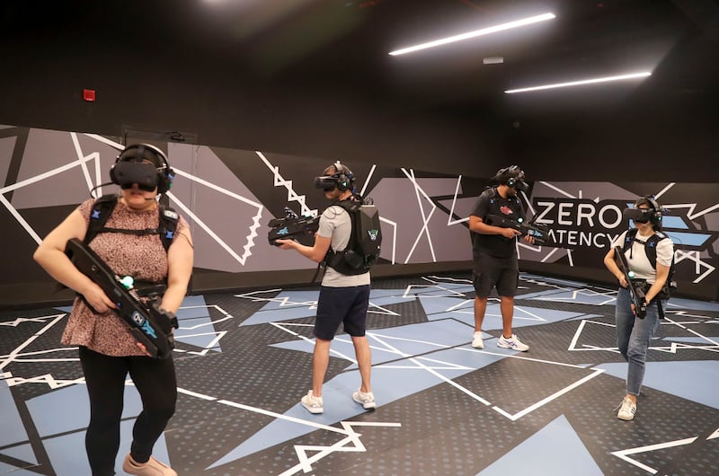 Players immersed in 'Outbreak Origins' roam around the game space at Zero Latency