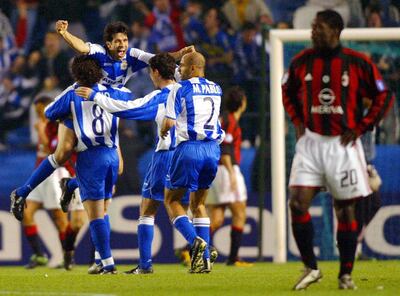 Deportivo Coruna's players Sergio Gonzalez, Juan Valeron, Victor Sanchez and Manuel Pablo Garcia (L to R) celebrate after scoring 3rd goal against AC Milan during the European Champions League quarterfinal second leg match at Riazor Stadium in Coruna, 07 April 2004. AFP Photo / Miguel RIOPA / AFP PHOTO / MIGUEL RIOPA