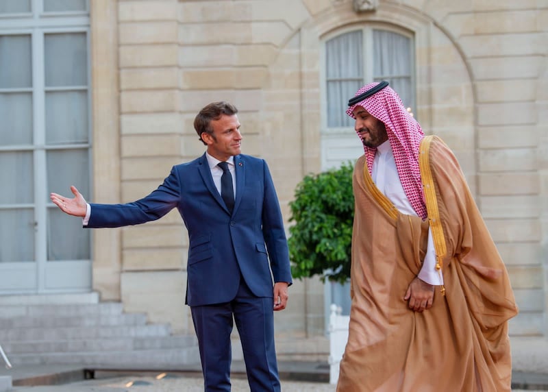 Mr Macron invites Prince Mohammed into the palace. 