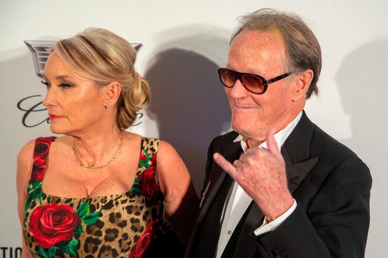 Peter Fonda and guest arrive at the 2019 Elton John AIDS Foundation Oscar Viewing Party on Sunday, February 24, 2019. AFP