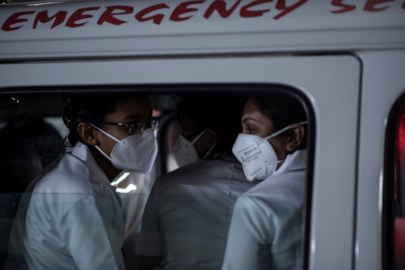 Health workers leave in an ambulance after a Covid-19 vaccination drive at a shopping mall in Kochi, Kerala state, India.