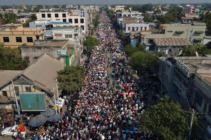 Protesters march on a road during a demonstration against the military coup in Shwebo in Myanmar's Sagaing Region. AFP