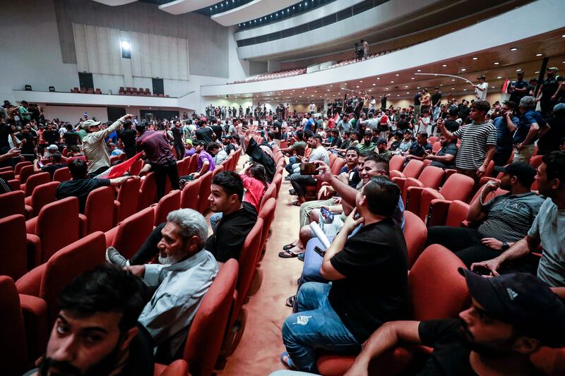 The protesters sit in the building, in Baghdad's high-security Green Zone. AFP