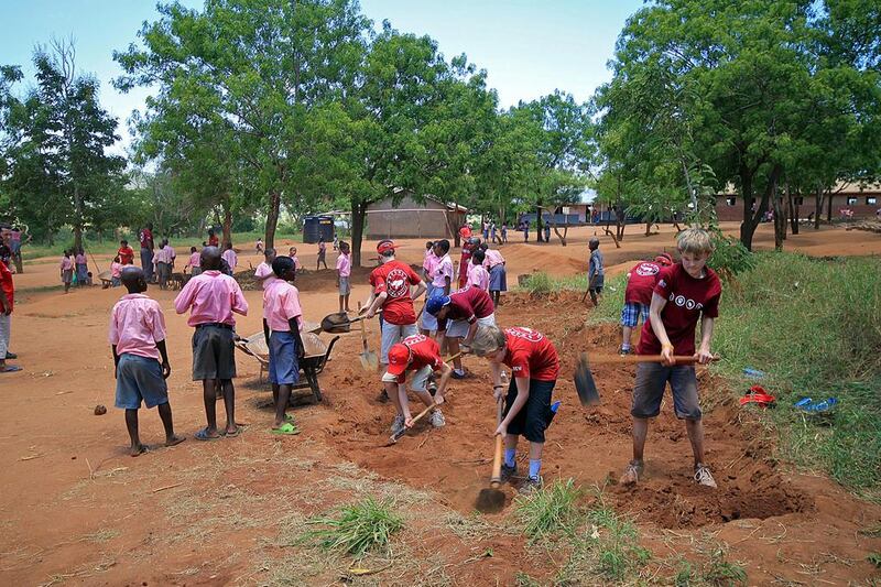 School pupils help out in a community project at Camp Tsavo in Kenya. Courtesy Camps International 