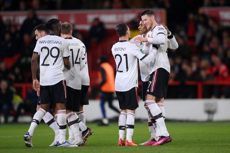 Wout Weghorst celebrates with teammates after scoring United's second goal. Getty