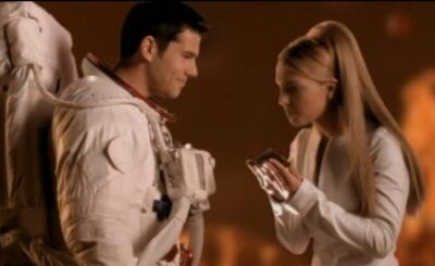 Eli Swanson and Britney Spears in the 'Oops!… I Did It Again' music video in 2000. YouTube 