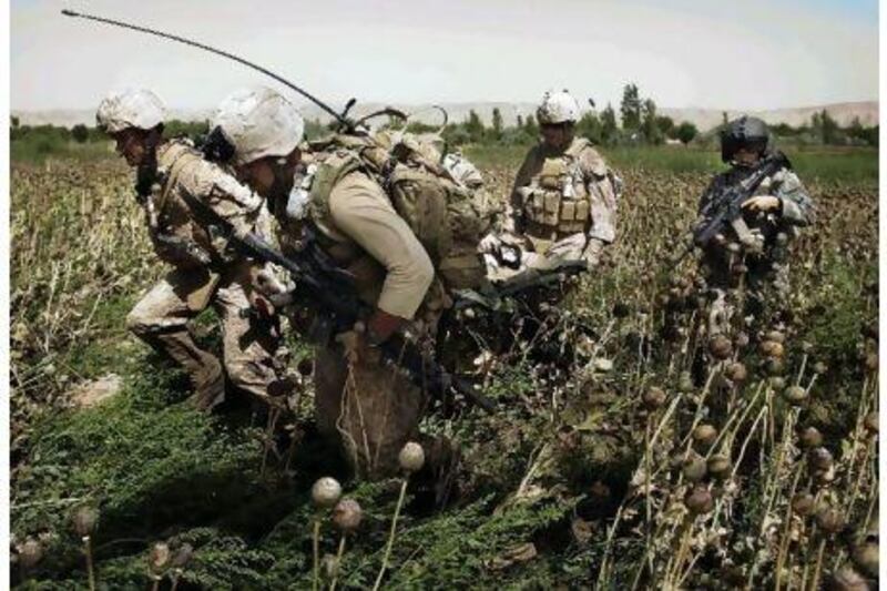 United States Marines rush a wounded colleague to a waiting helicopter in Helmand province, southern Afghanistan, Up to May 2, 11,191 members of the US military have been wounded in the war in Afghanistan, including 35 per cent so severely as to preclude their return to combat.