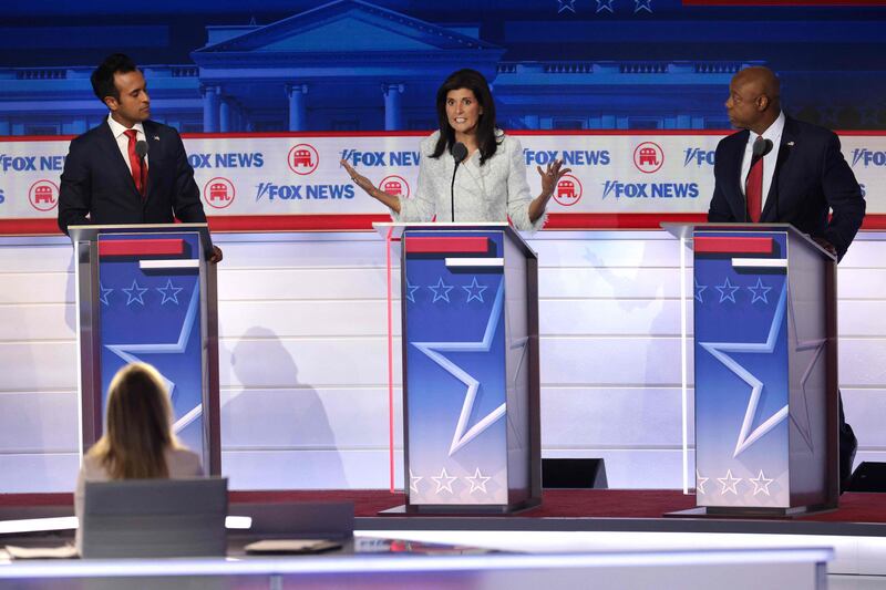 Republican presidential candidates (L-R), Vivek Ramaswamy, former U. N.  Ambassador Nikki Haley and US Senator  Tim Scott (R-SC) participate in the first debate of the GOP primary season hosted by FOX News on August 23, in Milwaukee, Wisconsin.  Getty Images / AFP