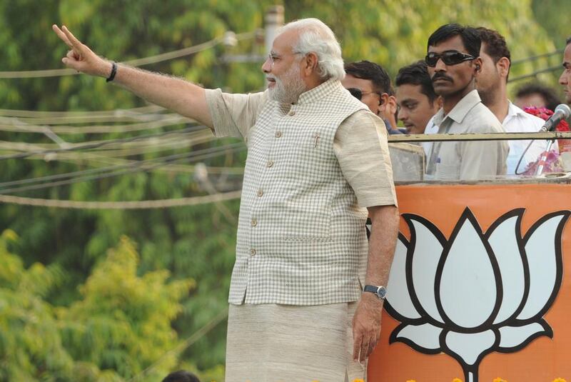 Narendra Modi arrives at a rally after his victory in Vadodara. “I want to make the 21st century India’s century. It will take 10 years, not very long,” he said. Indranil Mukherjee / AFP / May 16, 2014