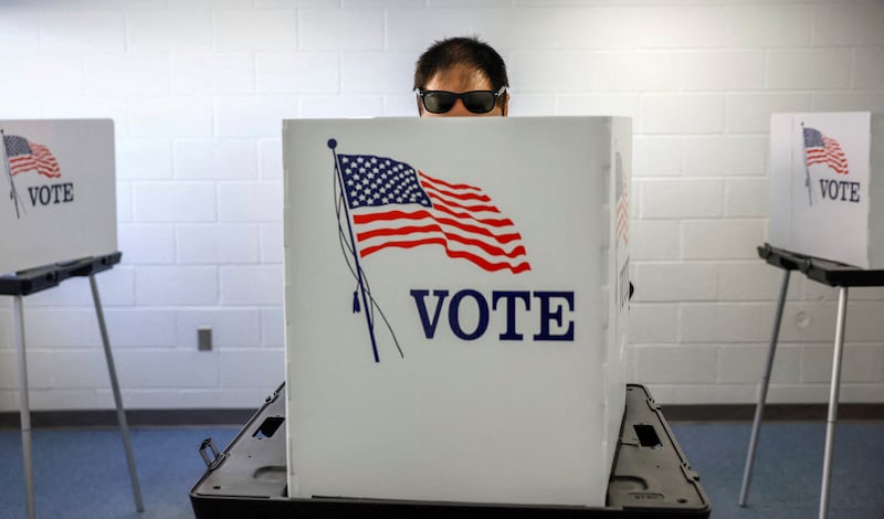 A voter during early voting ahead of the midterm election in Lansing, Michigan. Reuters