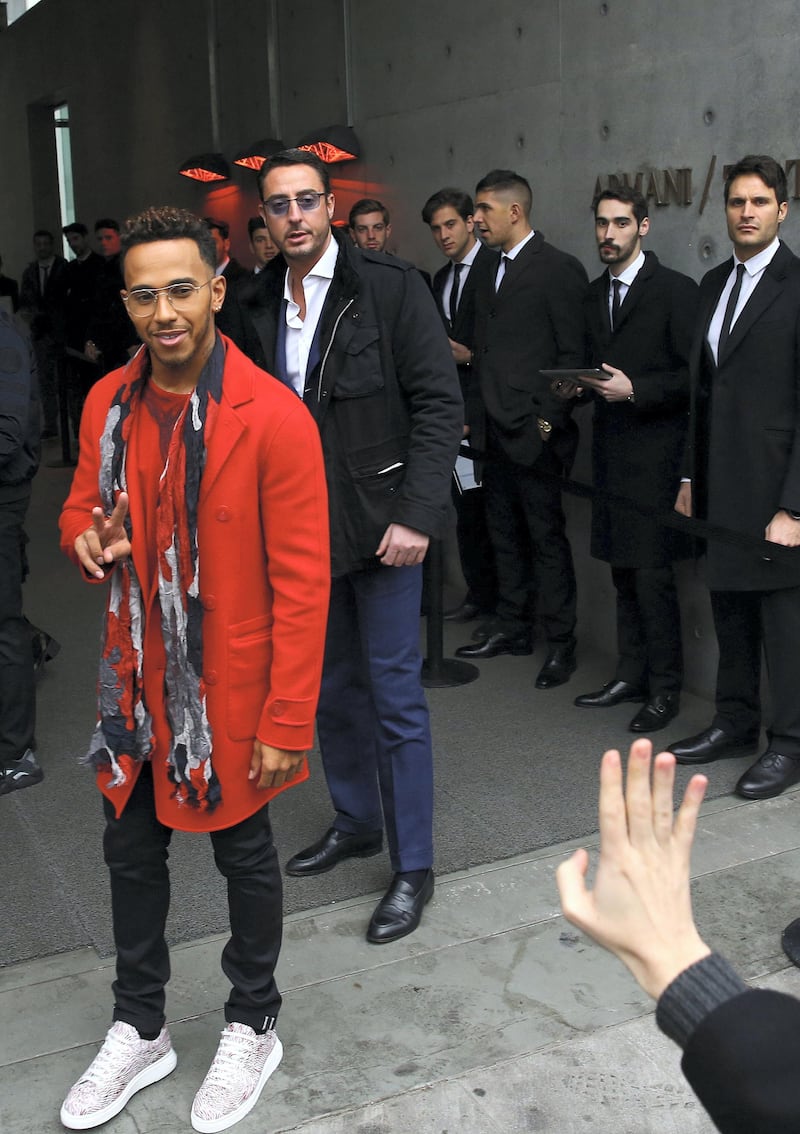 Formula One driver Lewis Hamilton of Britain arrives before Emporio Armani Autumn/Winter 2017 women collection show during Milan's Fashion Week in Milan, Italy February 24, 2017. REUTERS/Stefano Rellandini - RC1134C589A0