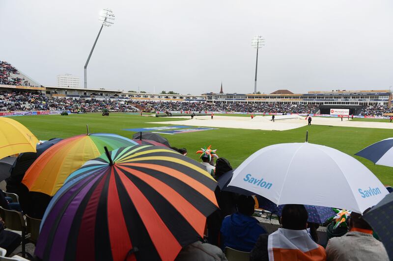 BIRMINGHAM, ENGLAND - JUNE 23:  Spectators shelter from the rain with the covers on during the ICC Champions Trophy Final between England and India at Edgbaston on June 23, 2013 in Birmingham, England.  (Photo by Gareth Copley/Getty Images) *** Local Caption ***  171190075.jpg