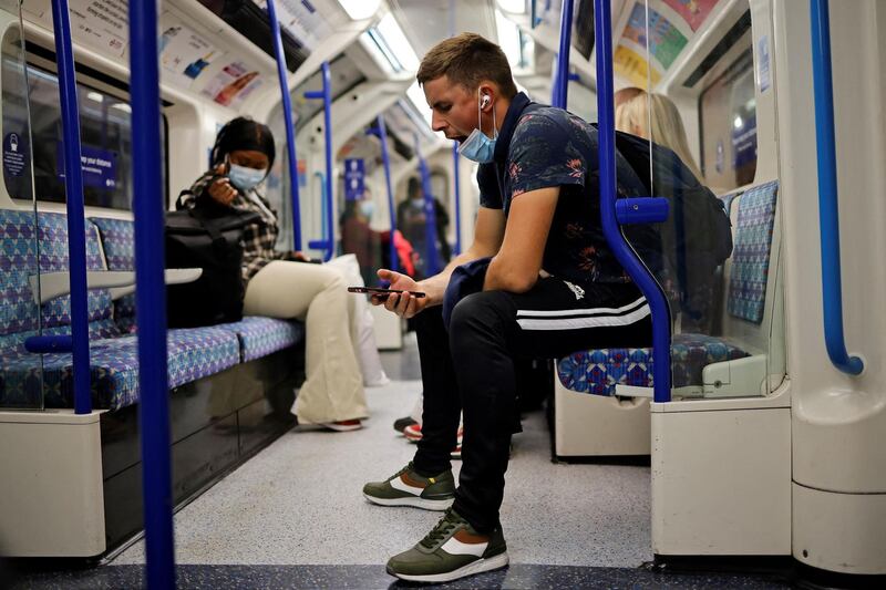 A commuter in the carriage of London Underground Victoria Line train from central London. The Delta variant of the coronavirus, first discovered in India, is estimated to be 40 per cent more transmissible than the Alpha variant that caused the last wave of infections in the UK, Britain's health minister said on Sunday. AFP