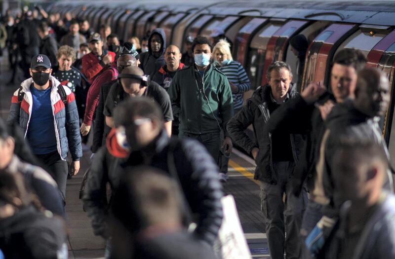 LONDON, ENGLAND- MAY 14: Commuters exit the tube at West Ham station in East London on May 14, 2020 in London, United Kingdom. The prime minister announced the general contours of a phased exit from the current lockdown, adopted nearly two months ago in an effort curb the spread of Covid-19. (Photo by Justin Setterfield/Getty Images)