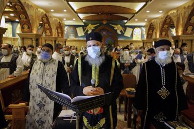 An Orthodox Egyptian Christian priest observes Good Friday prayers at church in Heliopolis in Cairo, Egypt, 30 April 2021. EPA