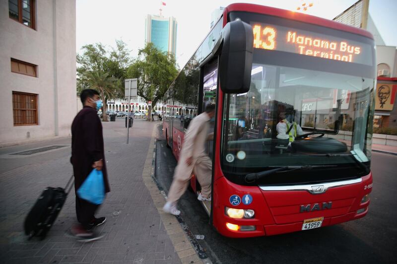 Travellers wearing face masks ride a bus, following the outbreak of the coronavirus disease in Manama, Bahrain. Reuters