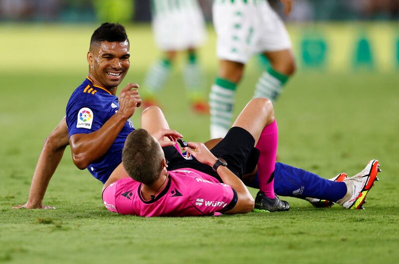 Real Madrid's Casemiro collides with referee Alejandro Hernandez during the La Liga game against Real Betis at the Estadio Benito Villamarin on Saturday, August 28. Reuters