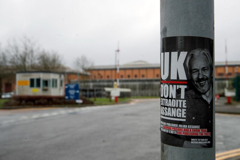 A sticker of WikiLeaks founder Julian Assange is attached to a sign outside HMP Belmarsh prison in London. Reuters