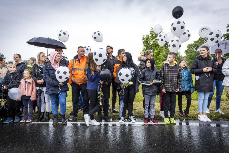 People take part in a silent march in memory of Gino in Kerkrade, the Netherlands. The boy, 9, had disappeared from a playground on June 1 and his remains were found days later. A suspect, 22, has been arrested. EPA