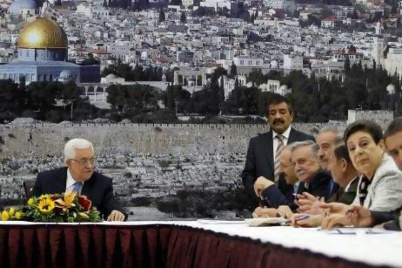 Palestinian President Mahmoud Abbas (left) attends a meeting of the Palestinian leadership in Ramallah to discuss the US-brokered resumption of peace talks.