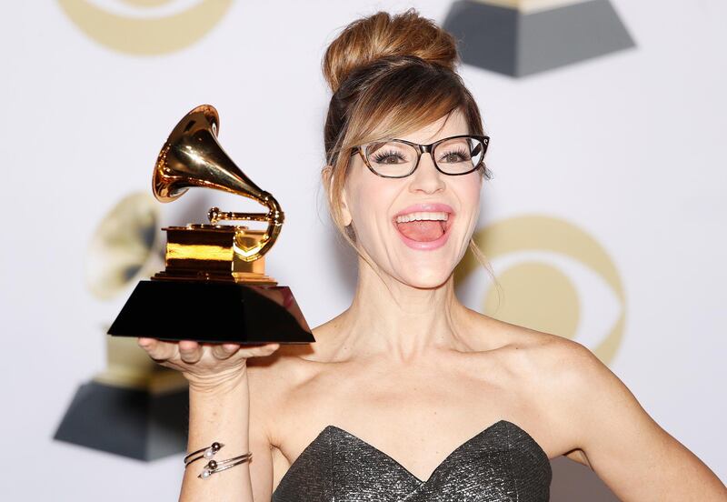 Lisa Loeb poses in the press room with the Grammy for Best Children's Album. EPA