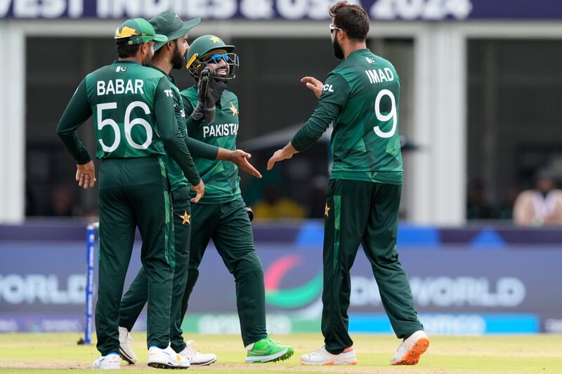 Pakistan's Imad Wasim, right, celebrates with teammates the wicket of Ireland's Gareth Delany. AP
