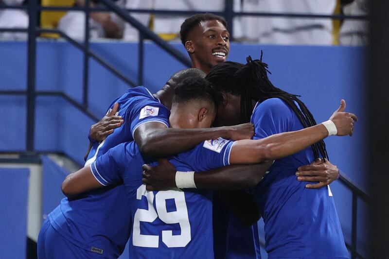 Al Hilal players celebrate their opening goal during the AFC Champions League semi-final against Al Nassr at King Saud University Stadium in Riyadh on Tuesday, October 19, 2021. Al Hilal won the match 2-1. AFP
