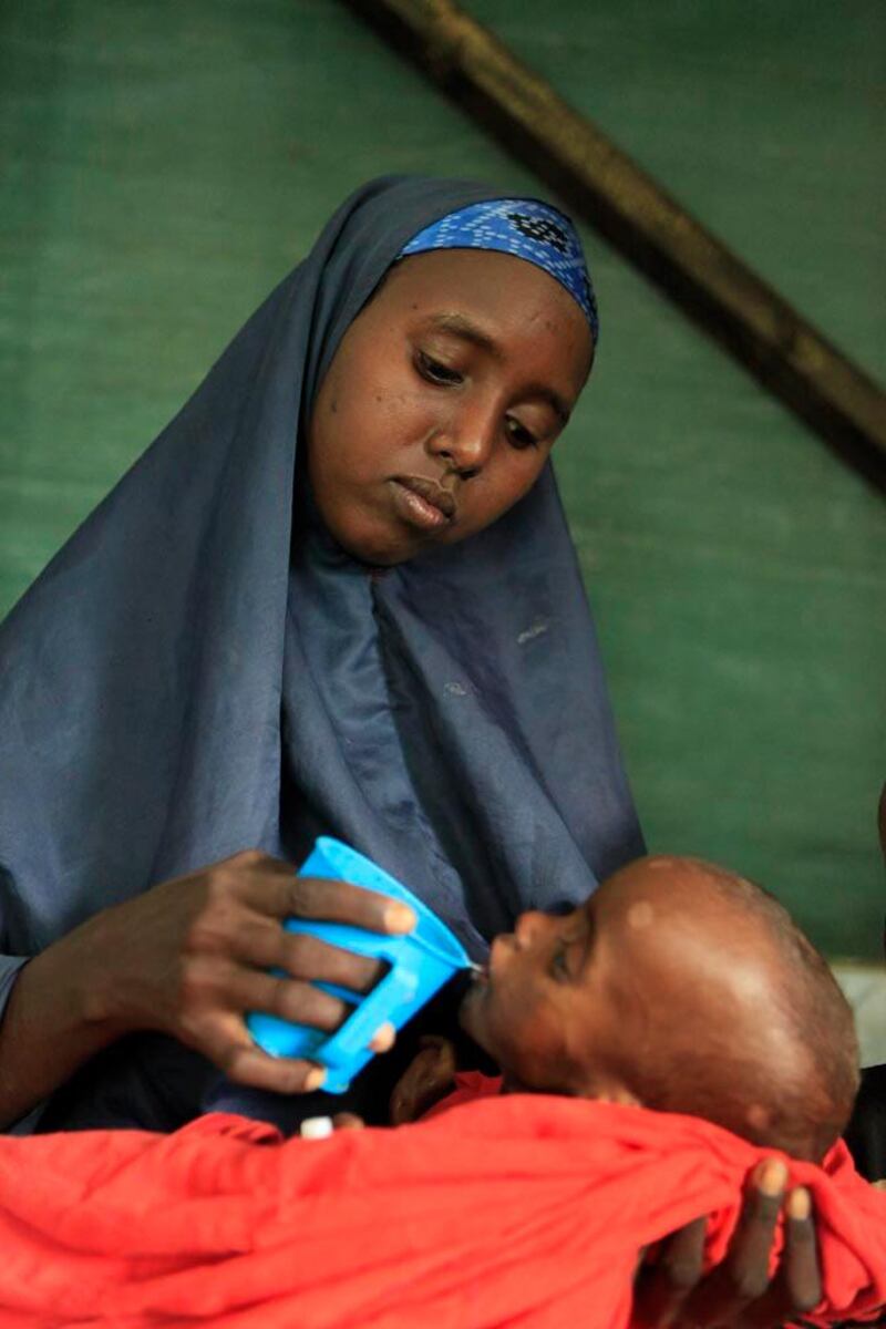 Marwo Maalin feeds her son, one-year-old Habibo Bashir, as part of his treatment for severe malnutrition, at a Doctors Without Borders hospital, in Dagahaley Camp, outside Dadaab, Kenya, Monday, July 11, 2011. U.N. refugee chief Antonio Guterres said Sunday that drought-ridden Somalia is the "worst humanitarian disaster" in the world, after meeting with refugees who endured unspeakable hardship to reach the world's largest refugee camp in Dadaab, Kenya. (AP Photo/Rebecca Blackwell)