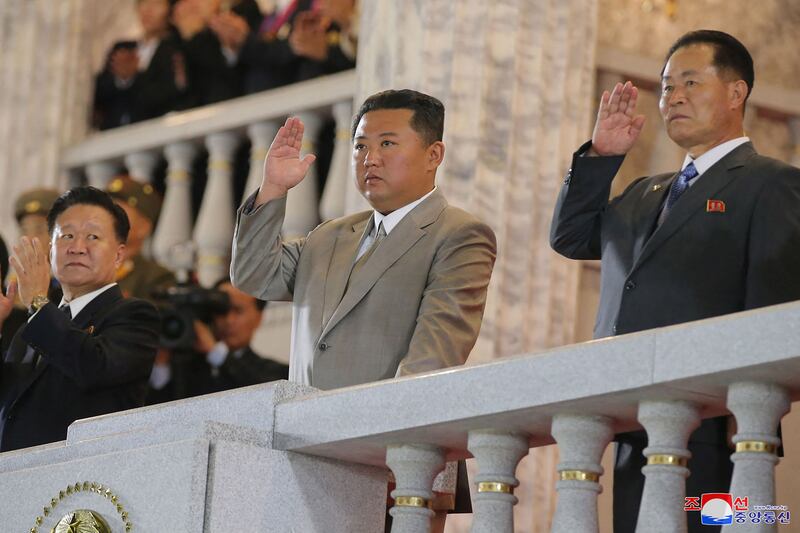 The North Korean leader with officials during the event.  AFP