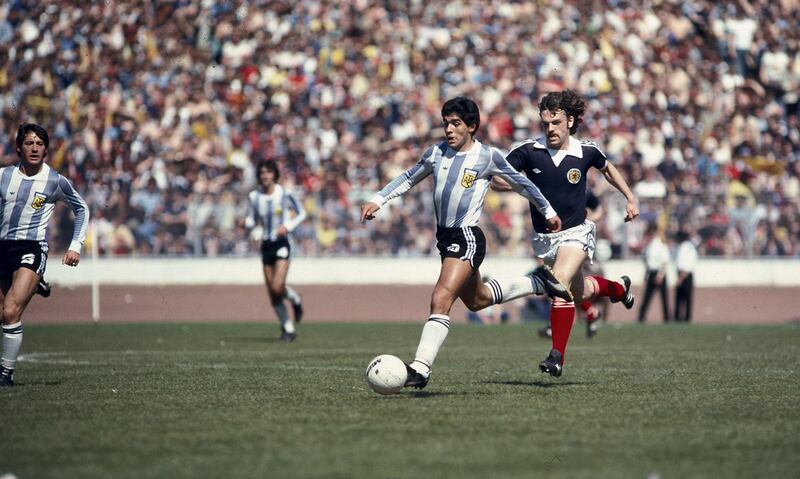 02 June 1979 - International football - Scotland v Argentina Diego Maradona runs with the ball as John Wark tries to keep up with the young Argentinian.. (Photo by Mark Leech/Getty Images)