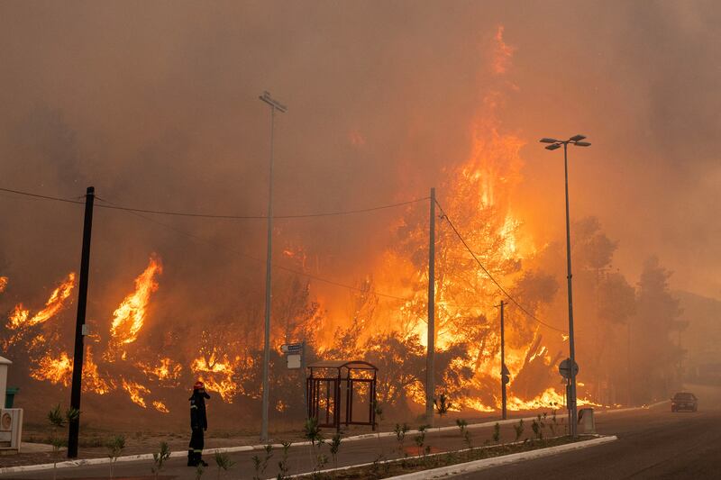The burning village of Hasia, near Athens. Reuters