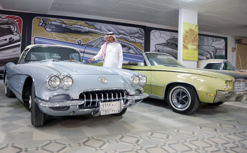 Nasser Al Masari examines one of his classic cars in Riyadh, Saudi Arabia.