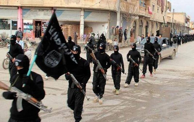 Fighters from the Al Qaeda linked Islamic State of Iraq and the Levant (Isil) marching in Raqqa, Syria in this undated file image posted on a militant website on Tuesday, January 14, 2014. Militant website, File/AP Photo