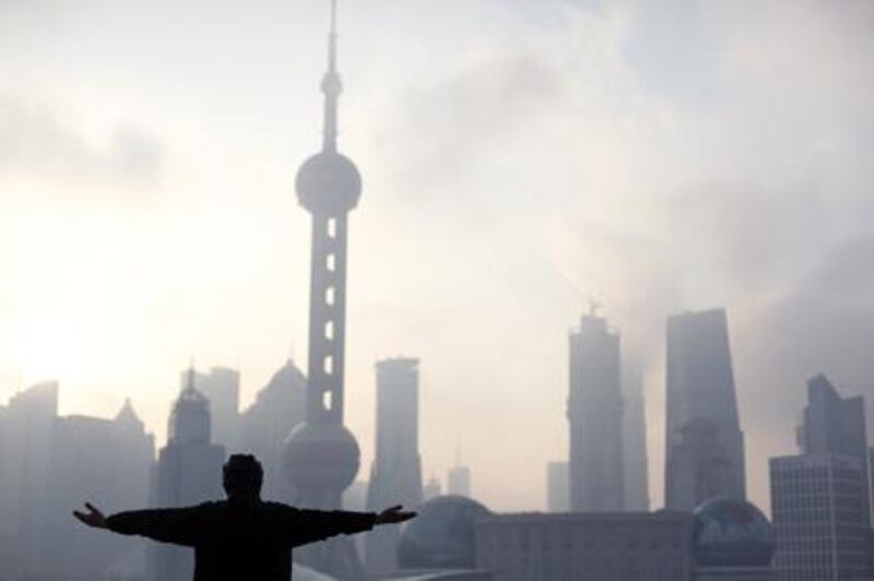 A man practices tai chi at the Bund, which has been reopened after a massive renovation for the Shanghai World Expo 2010.
