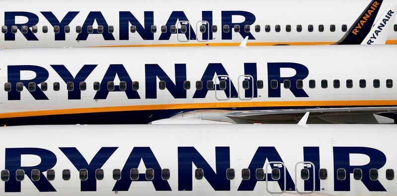 (FILES) In this file photo taken on August 20, 2020 Ryanair aircraft are pictured at Stansted airport, northeast of London. Irish no-frills airline Ryanair said on November 2, 2020, that it sank into a net loss in the first half of its financial year, as coronavirus savaged demand and grounded planes worldwide. / AFP / Adrian DENNIS
