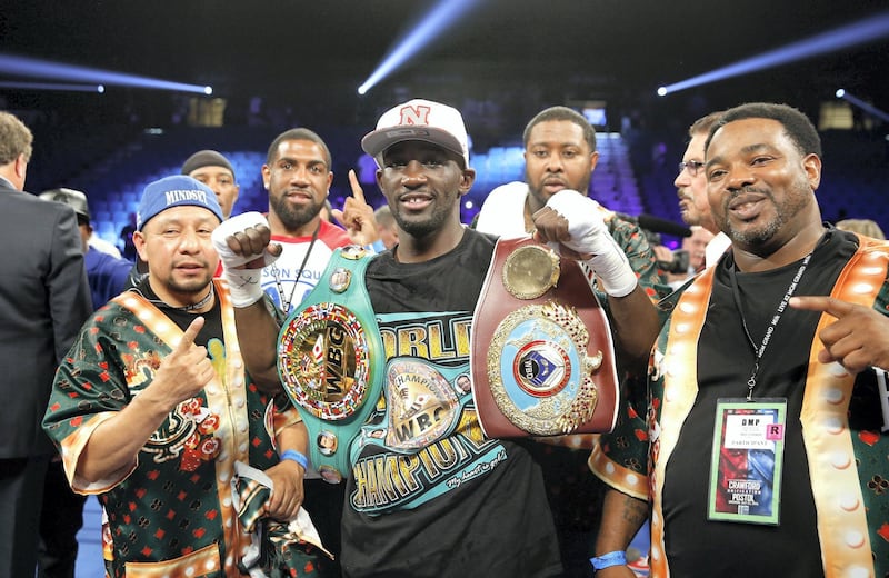 LAS VEGAS, NV - JULY 23:  WBO junior welterweight champion Terence Crawford (C) poses with members of his team after his unanimous decision victory over WBC champion Viktor Postol of Ukraine at MGM Grand Garden Arena on July 23, 2016 in Las Vegas, Nevada.  (Photo by Steve Marcus/Getty Images)