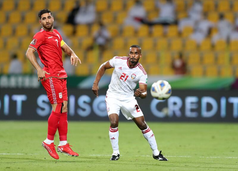 UAE's Mahmoud Khamis under pressure from Alireza Jahanbakhsh of Iran at the Zabeel Stadium. Chris Whiteoak / The National