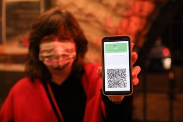 A visitor presents a coronavirus vaccination certificate at the entrance to Khan Theatre in Jerusalem on Tuesday. EPA