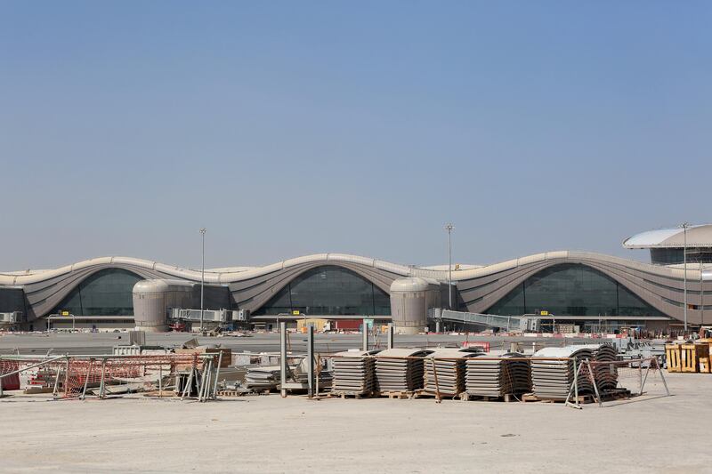 Building materials sit on the aircraft runway area outside Abu Dhabi airport's Midfield terminal during construction. Natalie Naccache / Bloomberg