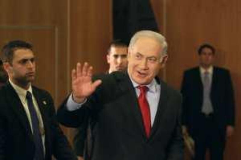 Israeli Prime Minister Benjamin Netanyahu, center, waves to attendees before speaking at the Conference of Presidents of Major Jewish Organizations in Jerusalem, Wednesday, Feb. 17, 2010. Netanyahu told leaders of American Jewish organizations Wednesday he would be "fine" with a third party bringing back the Israelis and Palestinians to peace talks. But he says direct talks will eventually be needed to end the conflict. (AP Photo/Tara Todras-Whitehill) *** Local Caption ***  JRL124_MIDEAST_ISRAEL_PALESTINIANS.jpg
