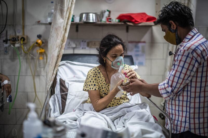 A worker attends to a patient in the emergency ward at the Holy Family hospital. Getty