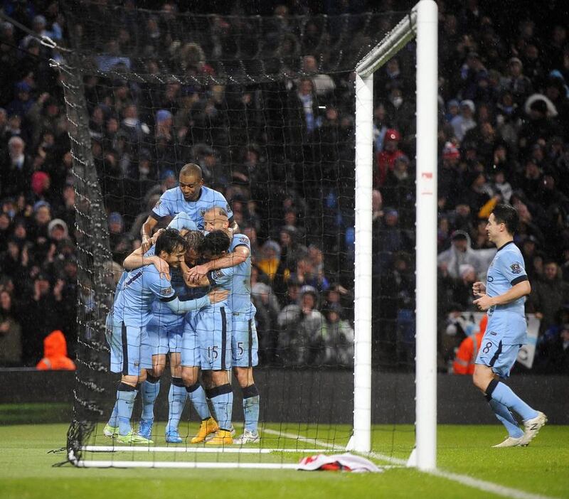 Frank Lampard, second from left, celebrates with his Manchester City teammates after scoring the winning goal during their Premier League match against Sunderland at Etihad Stadium in Manchester on Thursday. David Richards / EPA