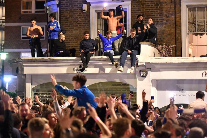 Chelsea supporters celebrate in streets surrounding their Stamford Bridge stadium in London their Champions League victory. PA